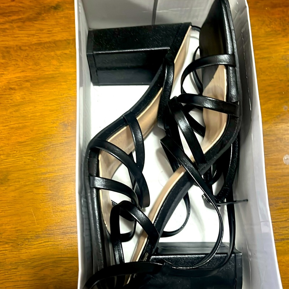 Size 10 fits like 9.5 black small heel/ wedge , tie up